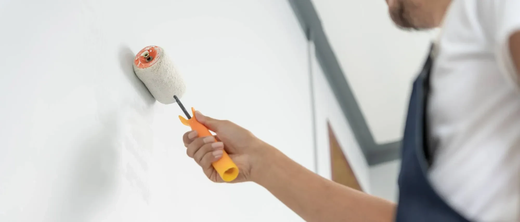 Painter Applying White Paint Oakland County Michigan