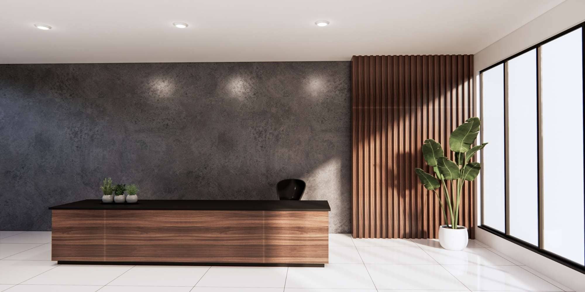 Modern minimalist reception area with a wooden desk, small potted plants, a black chair, textured gray wall, vertical wooden slats, large potted plant, and floor-to-ceiling windows—perfect inspiration for any Painter Macomb & Oakland Counties, MI.